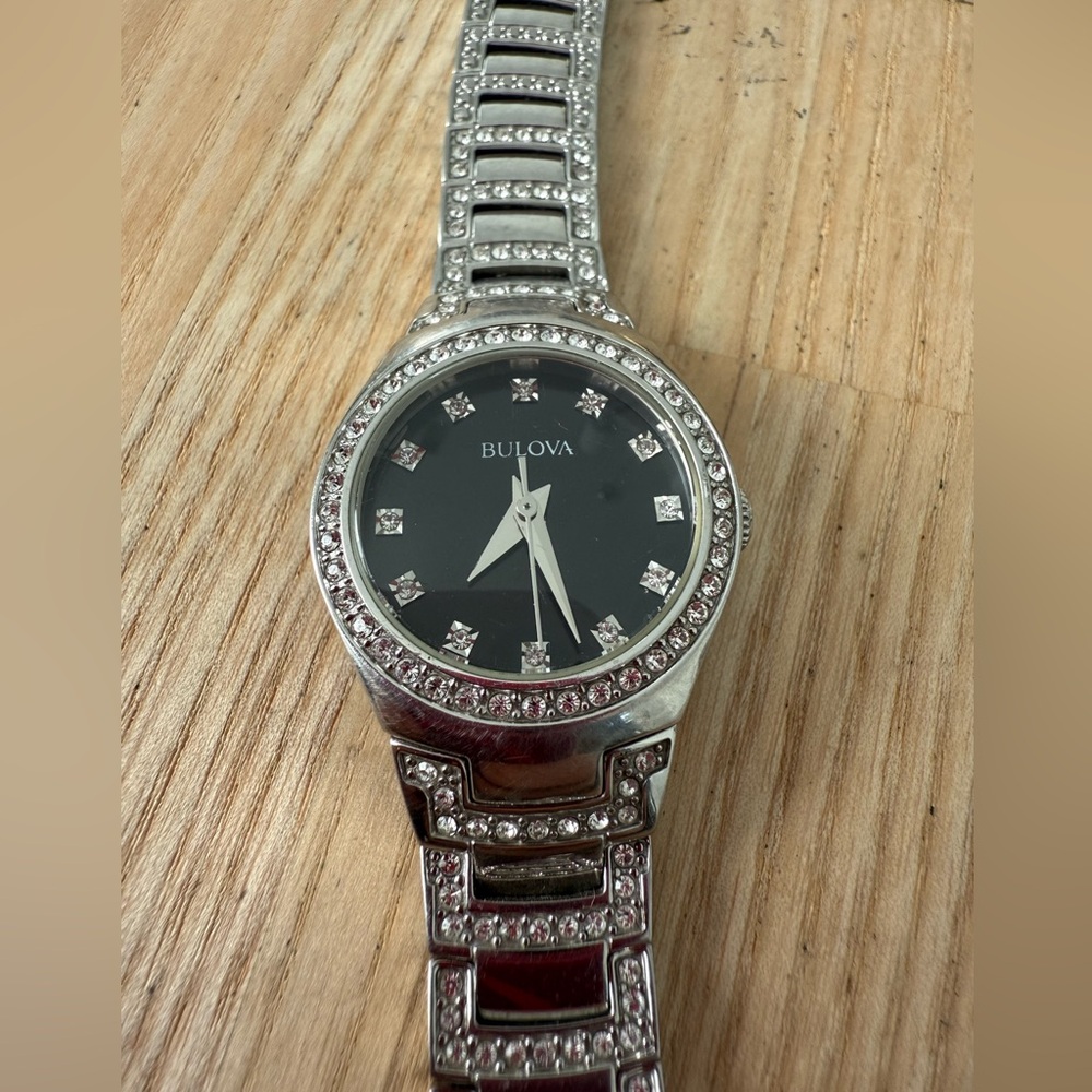 Bulova ladies black dial silver tone
